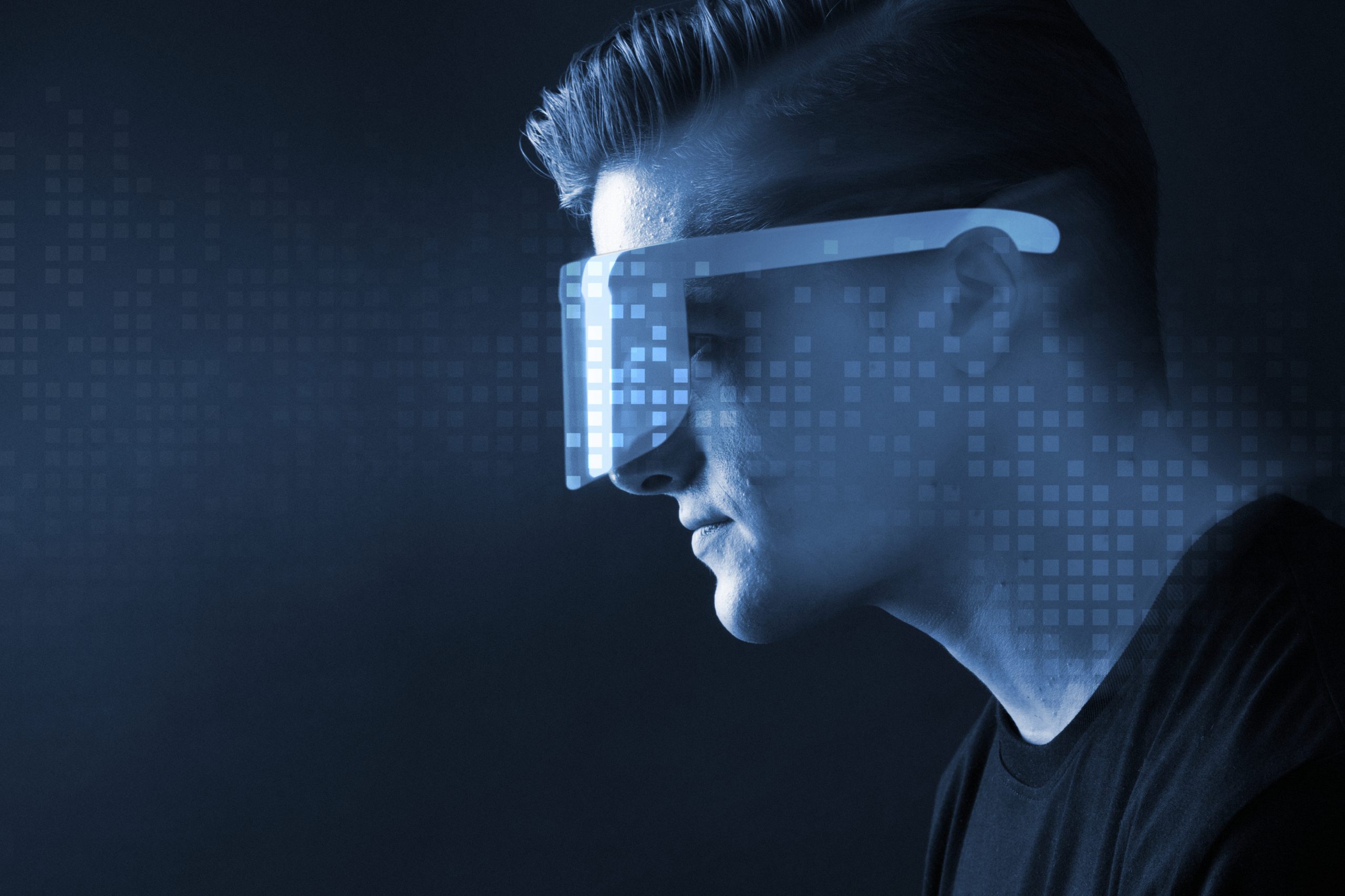 Man in glasses augmented reality blue